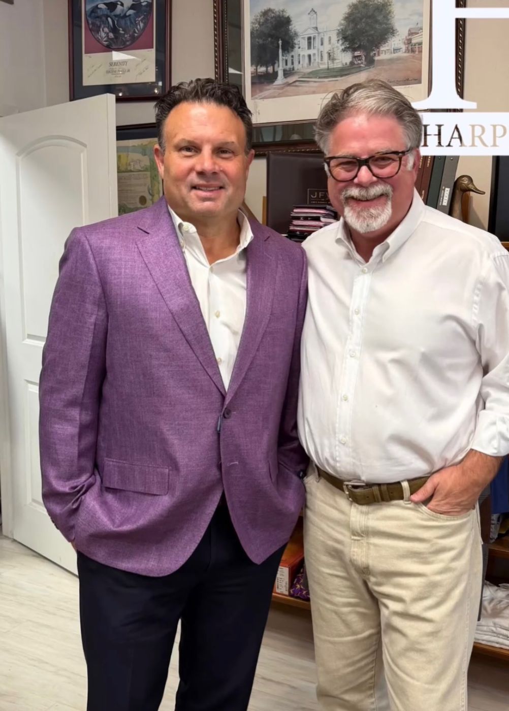 Two gentlemen in the shop, one in a purple sport coat